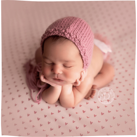 specialized training to safely pose newborns in classic newborn photography poses minneapolis minnesota