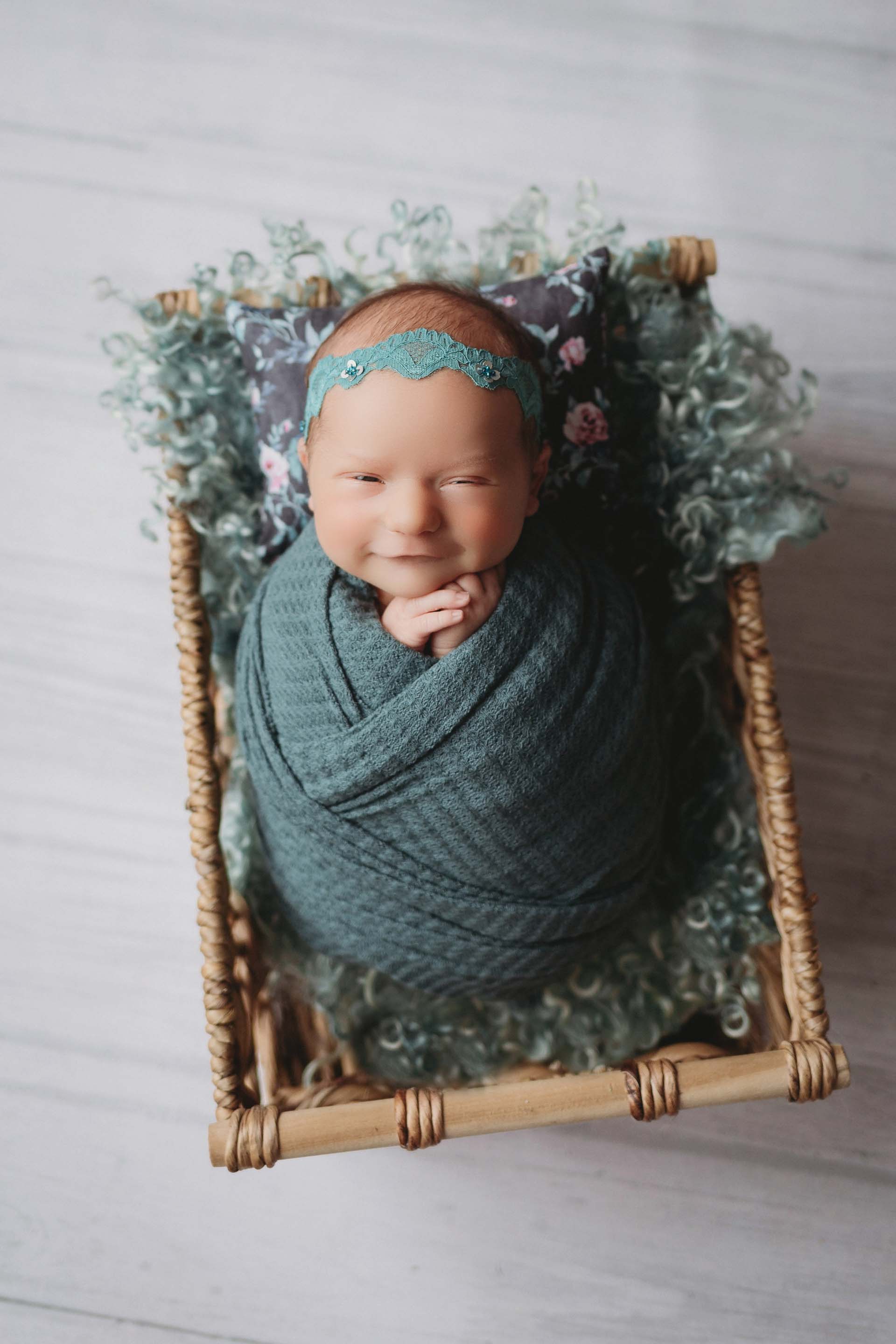 baby girl in teal wrap in basket minneapolis minnesota newborn photographer